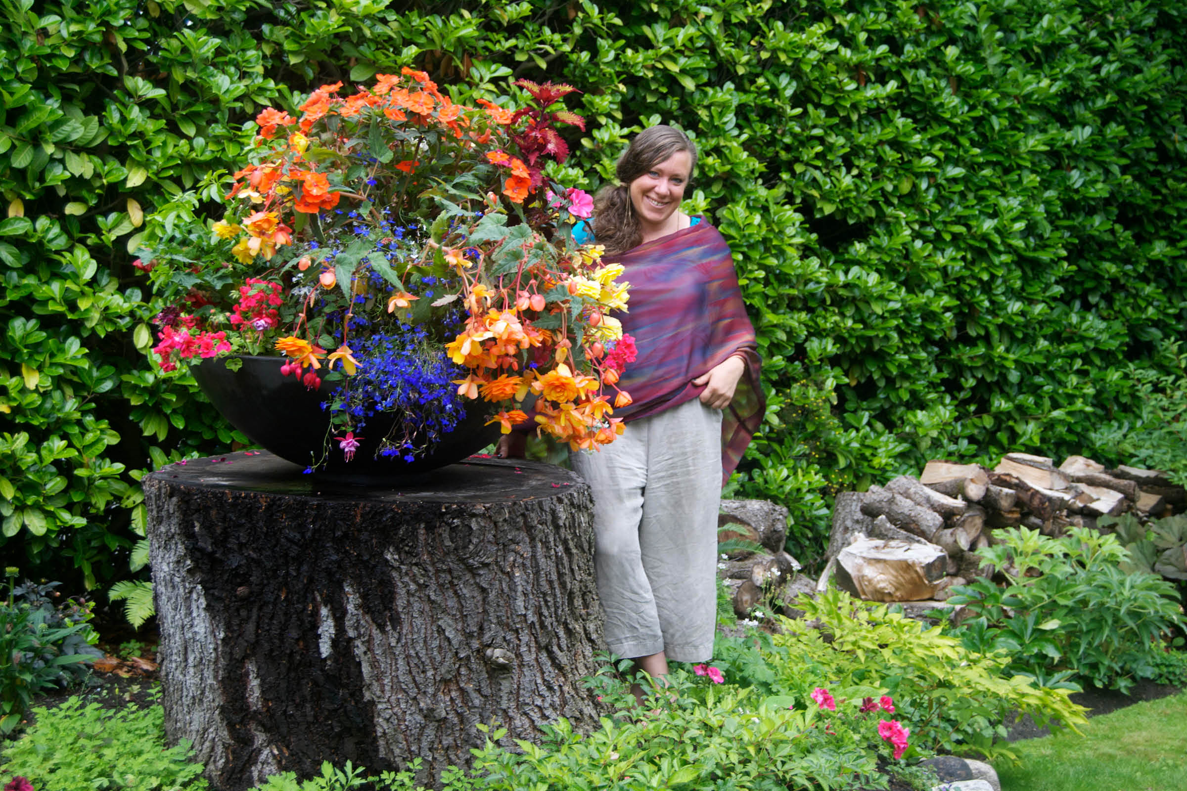 Alyssa next to a large planter